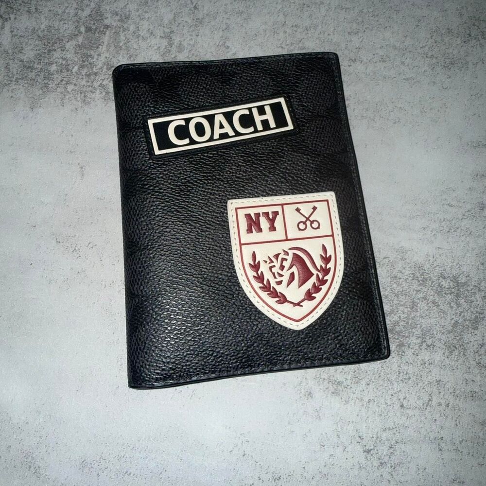 Coach black passport case with patches